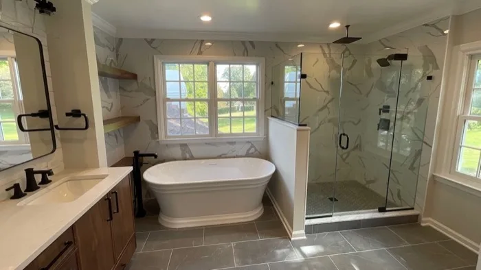 Spa-inspired bathroom remodel with floor-to-ceiling marble tile