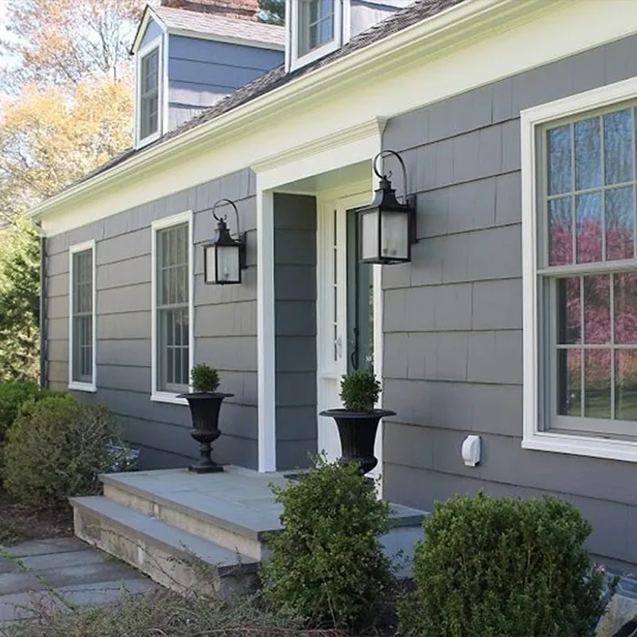 Freshly painted gray home exterior with white trim